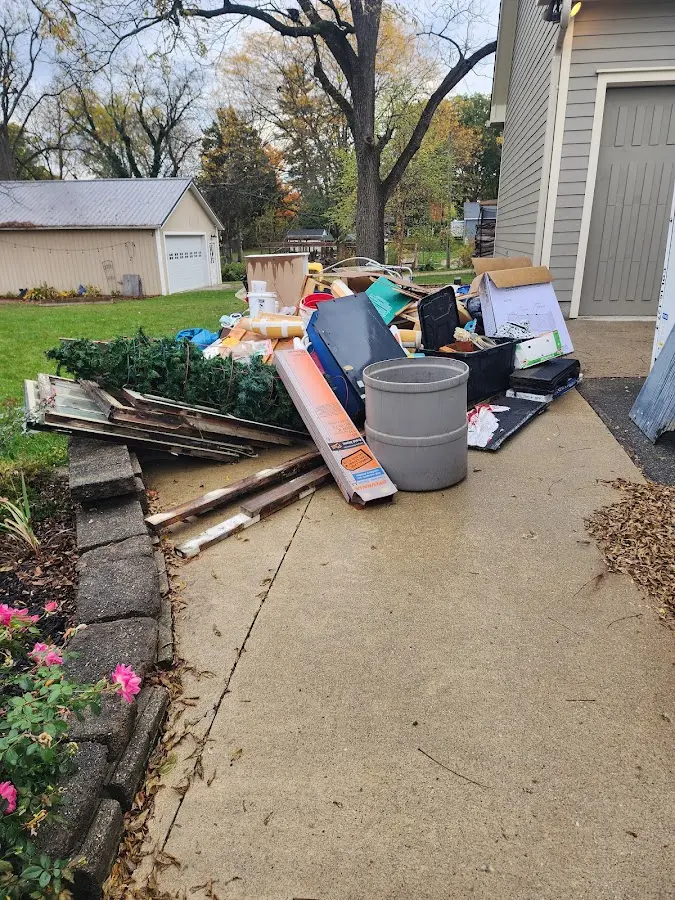 Dumpster being loaded with debris for 30 Yard Dumpster Rental in Spring Valley